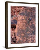 A Climber Ascends a Rock Face-null-Framed Photographic Print