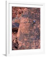 A Climber Ascends a Rock Face-null-Framed Photographic Print