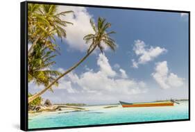 A colourful boat on the beautiful Island Pelicano in the San Blas Islands, Kuna Yala, Panama-Chris Mouyiaris-Framed Stretched Canvas