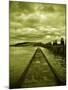 A Concrete Jetty on Water under a Stormy Sky-Cristina Carra Caso-Mounted Photographic Print