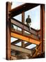 A Construction Worker Stands on a Steel Beam While Working on a High Rise Building-null-Stretched Canvas