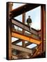 A Construction Worker Stands on a Steel Beam While Working on a High Rise Building-null-Framed Stretched Canvas