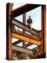 A Construction Worker Stands on a Steel Beam While Working on a High Rise Building-null-Stretched Canvas