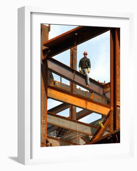 A Construction Worker Stands on a Steel Beam While Working on a High Rise Building-null-Framed Photographic Print