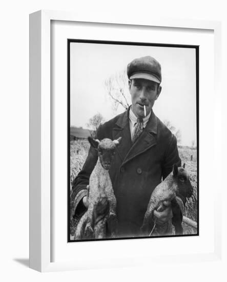 A Cotswolds Farmer Holds Two New-Born Lambs-Henry Grant-Framed Photographic Print