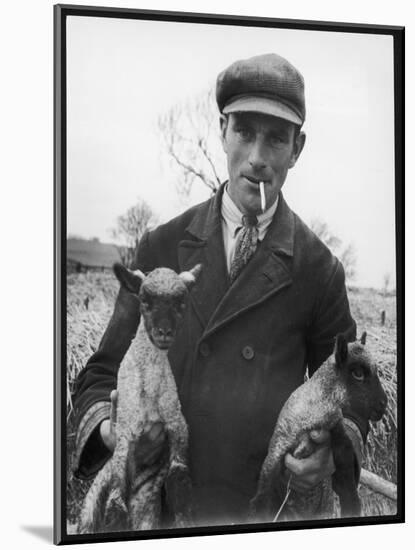 A Cotswolds Farmer Holds Two New-Born Lambs-Henry Grant-Mounted Photographic Print