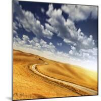 A Country Road in Field Against Moody Sky, Tuscany, Italy-null-Mounted Photographic Print