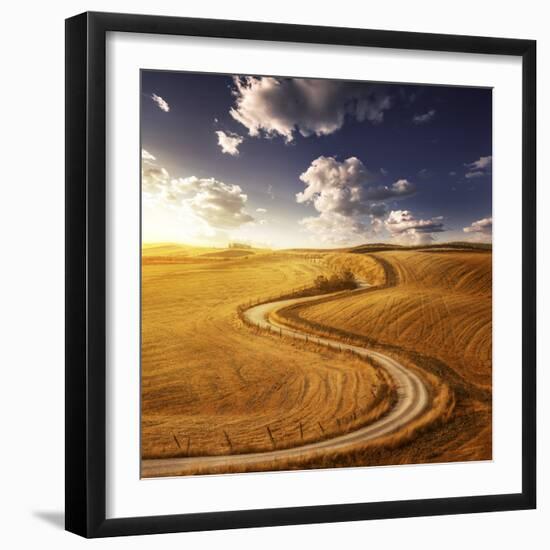 A Country Road in Field at Sunset Against Moody Sky, Tuscany, Italy-null-Framed Photographic Print