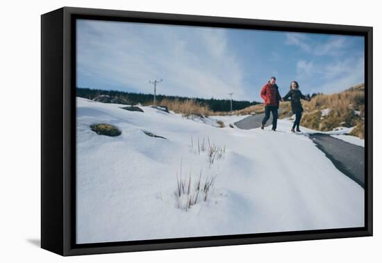 A Couple Holding Each Other on Top of a Mountain-Clive Nolan-Framed Stretched Canvas