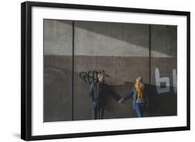 A Couple Holding Hands in an Underpass-Clive Nolan-Framed Photographic Print
