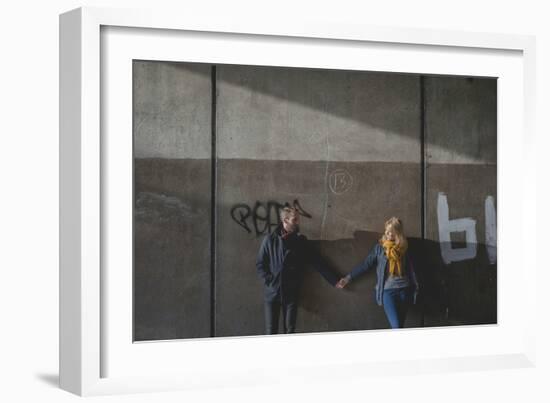 A Couple Holding Hands in an Underpass-Clive Nolan-Framed Photographic Print