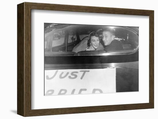 A Couple Peers Out of the Back Window on their Wedding Day, Ca. 1953-null-Framed Photographic Print