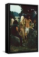 A Couple Stand Together at the Woodstock Music and Arts Fair, Bethel, New York, August 1969-John Dominis-Framed Stretched Canvas