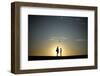 A Couple Stands on a Sand Bank as the Sun Sets in Venice, Los Angeles-Lucy Nicholson-Framed Photographic Print