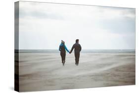 A Couple Together on a Winter S Day on a Beach-Clive Nolan-Stretched Canvas