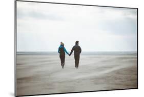 A Couple Together on a Winter S Day on a Beach-Clive Nolan-Mounted Photographic Print