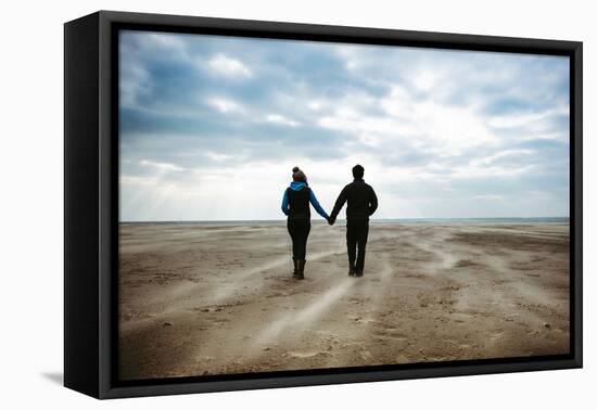 A Couple Together on a Winters Day on a Beach-Clive Nolan-Framed Stretched Canvas