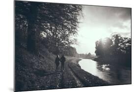 A Couple Walking Along a Canal on a Wet Day-Clive Nolan-Mounted Photographic Print