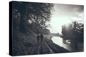A Couple Walking Along a Canal on a Wet Day-Clive Nolan-Stretched Canvas