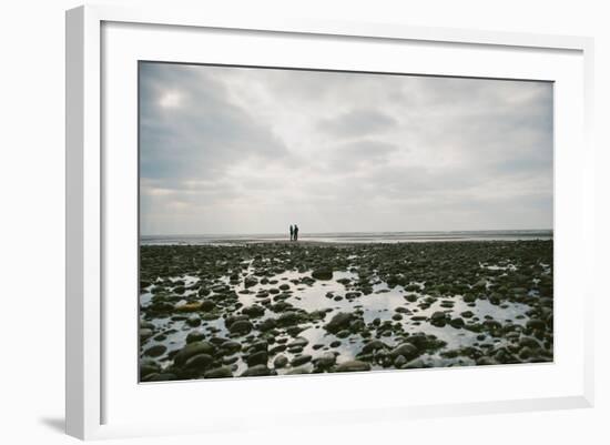 A Couple Walking Together on a Winter Day on a Beach-Clive Nolan-Framed Photographic Print