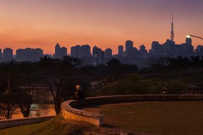 https://imgc.allpostersimages.com/img/posters/a-couple-watch-the-sunset-in-praca-do-por-do-sol-sunset-square-in-sao-paulo_u-L-POL9FR0.jpg?artPerspective=n