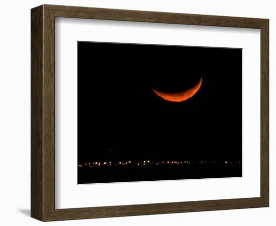 A Crescent Moon Dwarfs the Lights of Fort Riley Army Base in Central Kansas, January 22, 2007-Charlie Riedel-Framed Photographic Print