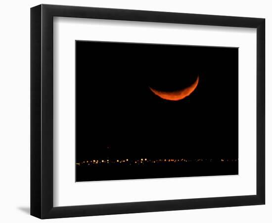 A Crescent Moon Dwarfs the Lights of Fort Riley Army Base in Central Kansas, January 22, 2007-Charlie Riedel-Framed Photographic Print