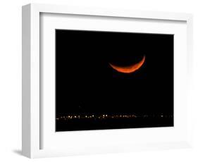 A Crescent Moon Dwarfs the Lights of Fort Riley Army Base in Central Kansas, January 22, 2007-Charlie Riedel-Framed Photographic Print