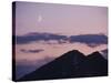 A Crescent Moon Rises over Clouds and Mountains at Twilight in Glacier Peak Wilderness, Washington.-Ethan Welty-Stretched Canvas