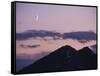 A Crescent Moon Rises over Clouds and Mountains at Twilight in Glacier Peak Wilderness, Washington.-Ethan Welty-Framed Stretched Canvas