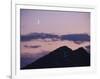 A Crescent Moon Rises over Clouds and Mountains at Twilight in Glacier Peak Wilderness, Washington.-Ethan Welty-Framed Photographic Print