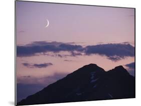 A Crescent Moon Rises over Clouds and Mountains at Twilight in Glacier Peak Wilderness, Washington.-Ethan Welty-Mounted Photographic Print