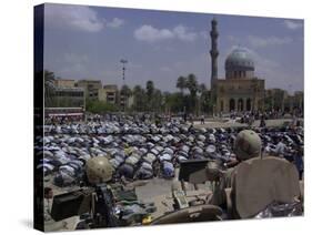 A Crowd of Iraqi Protesters Pray in Front of a U.S. Military Checkpoint-null-Stretched Canvas