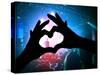 A Crowd of People at a Concert with a Heart Shaped Hand Shadow-graphicphoto-Stretched Canvas