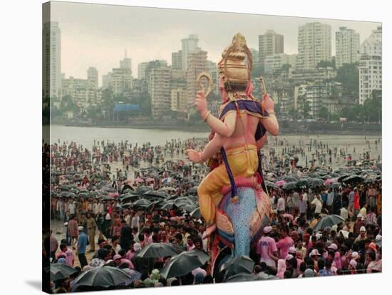 A Crowd of Revellers Carry a Statue of Ganesh-null-Stretched Canvas