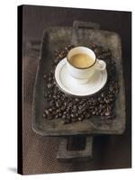 A Cup of Espresso on a Wooden Bowl with Coffee Beans-Anita Oberhauser-Stretched Canvas