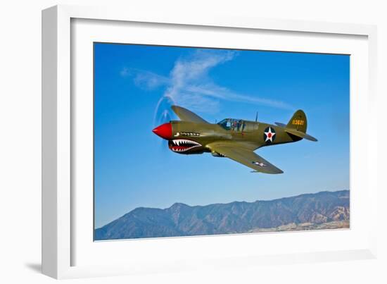 A Curtiss P-40E Warhawk in Flight Near Chino, California-null-Framed Photographic Print