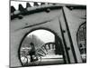 A Cyclist Passes a Draw Bridge as Snow Covers the City Center of Amsterdam-null-Mounted Premium Photographic Print