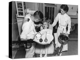 A Dentist Examining a Young Girl's Teeth in 1942-null-Stretched Canvas