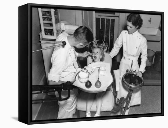 A Dentist Examining a Young Girl's Teeth in 1942-null-Framed Stretched Canvas