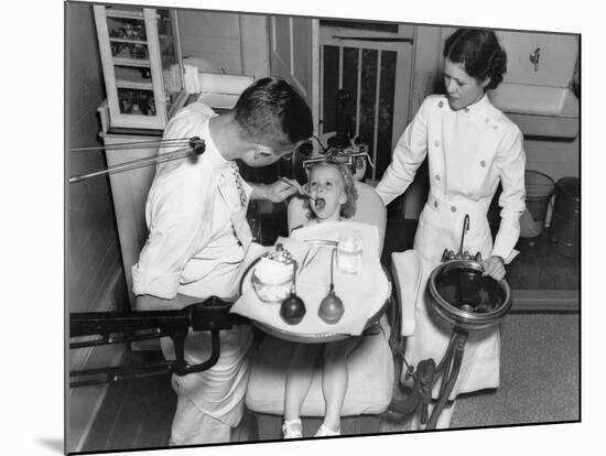 A Dentist Examining a Young Girl's Teeth in 1942-null-Mounted Photo