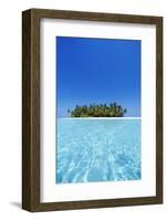 A deserted tropical island covered with palm trees amidst calm turquoise water.-Stuart Westmorland-Framed Photographic Print