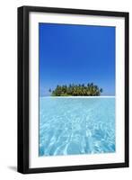 A deserted tropical island covered with palm trees amidst calm turquoise water.-Stuart Westmorland-Framed Premium Photographic Print