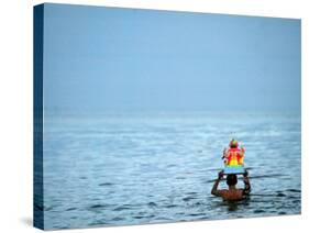 A Devotee Immerses the Idol of Elephant-Headed Hindu God Ganesh-null-Stretched Canvas