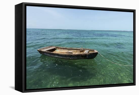 A Dingy Floats by Itself on Open Green Waters Near the Southern Coast of Cuba-James White-Framed Stretched Canvas