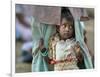 A Displaced Tamil Child Hangs to Her Father's Sarong-Gemunu Amarasinghe-Framed Photographic Print