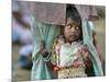 A Displaced Tamil Child Hangs to Her Father's Sarong-Gemunu Amarasinghe-Mounted Photographic Print