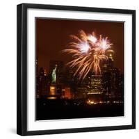 A Display of Fireworks Illuminates the Sky Near the Statue of Liberty-null-Framed Photographic Print