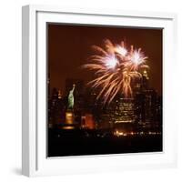 A Display of Fireworks Illuminates the Sky Near the Statue of Liberty-null-Framed Photographic Print