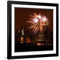 A Display of Fireworks Illuminates the Sky Near the Statue of Liberty-null-Framed Photographic Print